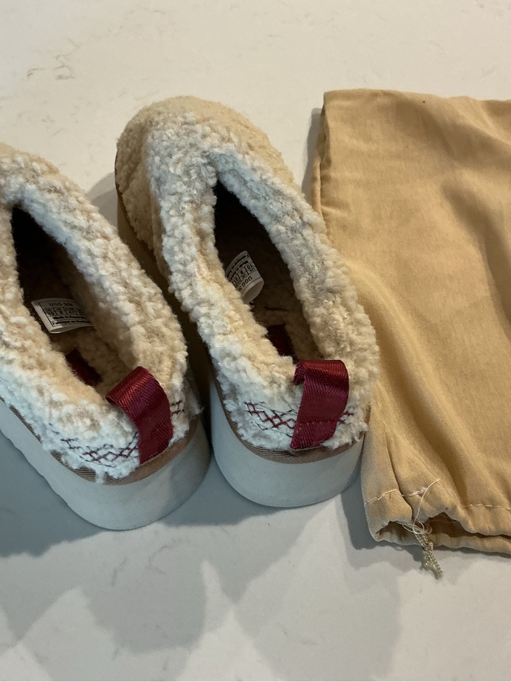 Cozy UGG Sherpa Lined Slip-On Shoes in Cream with Burgundy Tabs